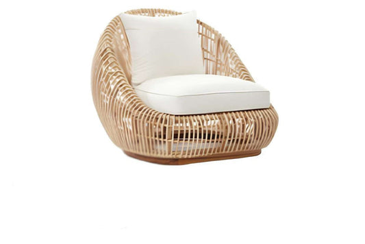 Sillón curvo de ratán con cojín