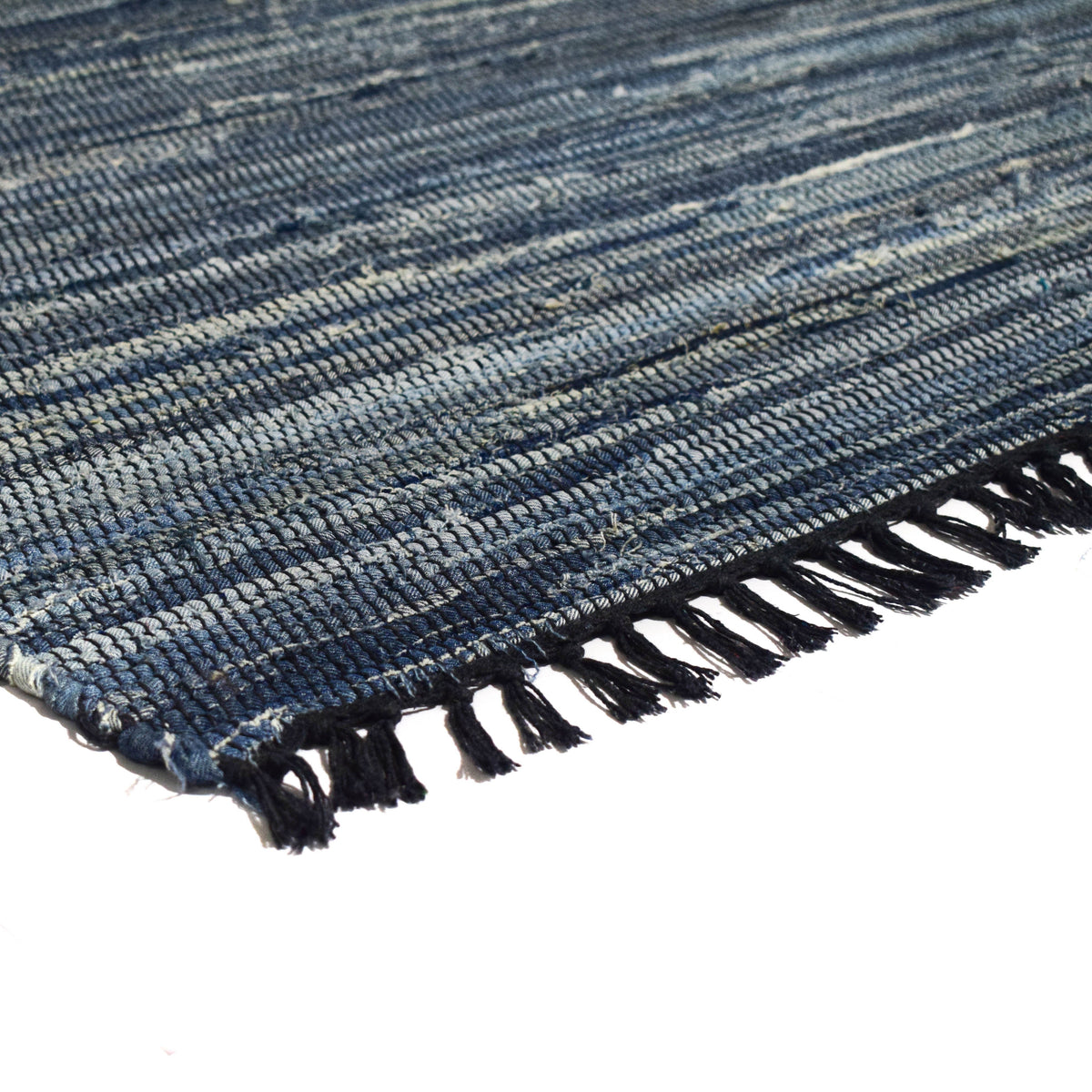 Detalle de alfombra denim IC9418 azul